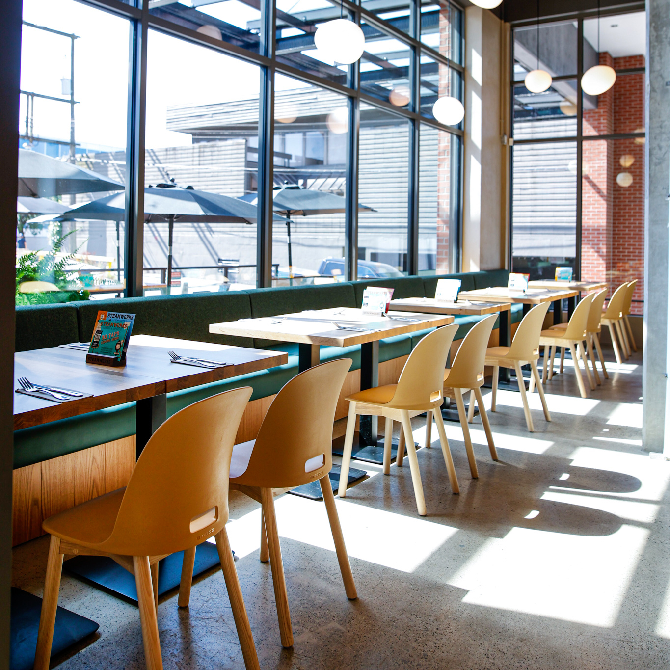 Beautiful restaurant with big bright windows.